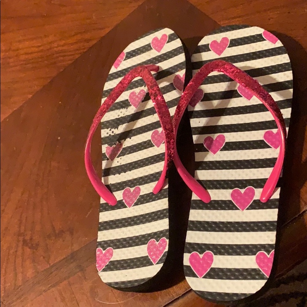 Shimmery pink glitter flip flops.